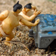 Illustration for article titled Tiny Sumo Wrestlers Pushing A Derelict Jeep Need A Haiku Caption